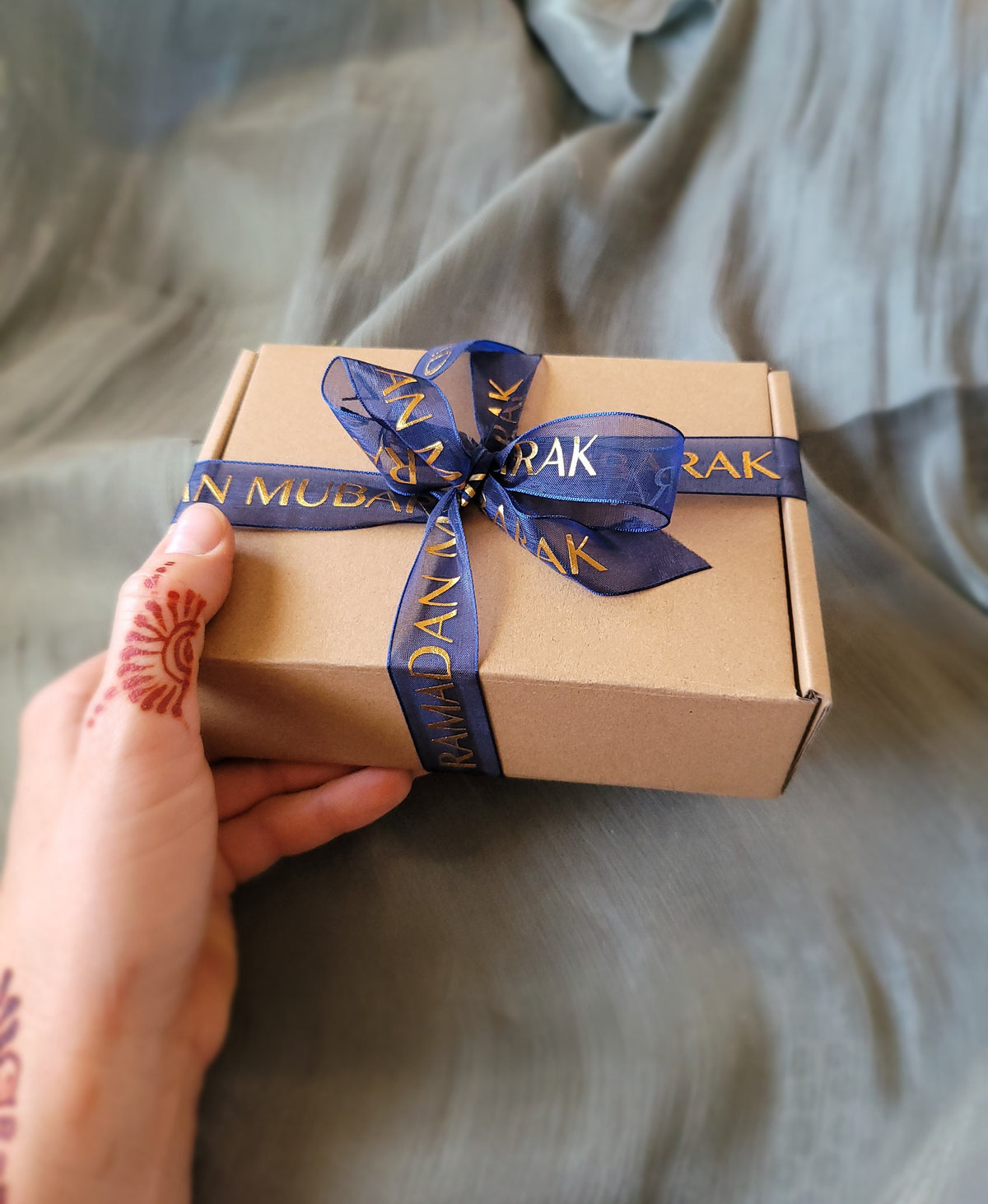 Small box with blue ribbon